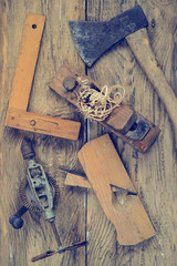 Rustic woodworking tools on old wooden table. Top view. copy space