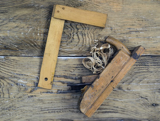 Rustic woodworking tools on old wooden table. Top view. copy space