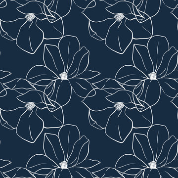 Trendy seamless floral print with magnolia flowers on deep blue color. Vector hand drawn illustration for print,textile,wrapping paper.