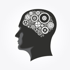 Silhouette of a man's head with gears in the shape of the brain