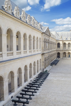 Inner yard with old cannon guns of the Hotel national des Invalides in Paris.