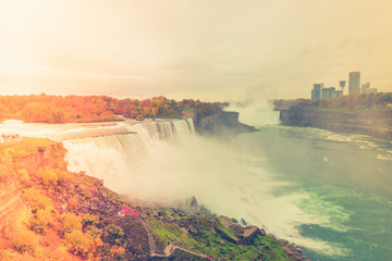 American side of Niagara Falls during sunrise .  ( Filtered image processed vintage effect. )