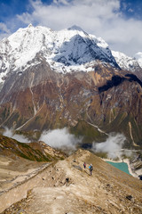 Trekker on the way to the valley covered with cloud on Manaslu circuit trek in Nepal