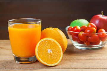 Healthy concept with mixed fruits and vegetables on wooden background