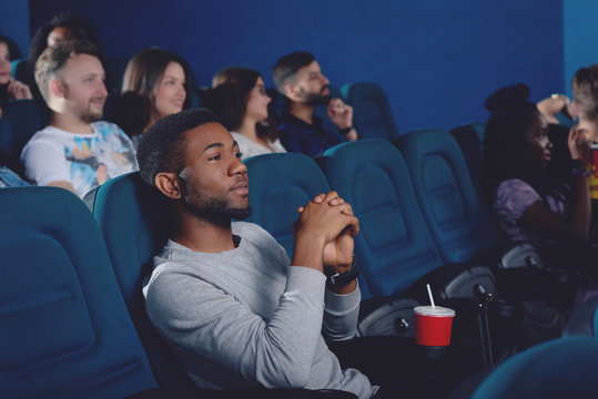 African Man Watching Movie In 3d Glasses.