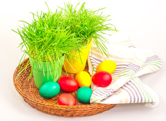 Easter eggs with grass and towel