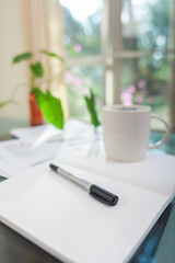 Open laptop and accessories with coffee cup for home workplace