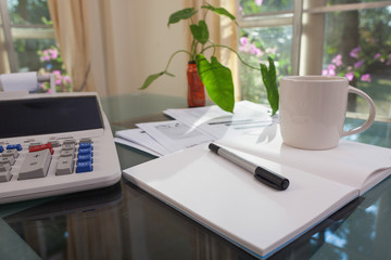 Open laptop and accessories with coffee cup for home workplace