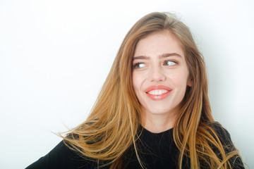 Naklejka premium sexy pretty smiling girl with long blond hair in black