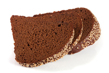Three slices of black bread with sesame seeds isolated on white background