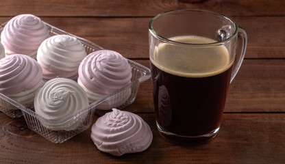 White and pink zephyr with a cup of coffee