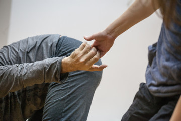 two hand dance.The hands of the dancers are drawn to each other.dancers' hands support each other