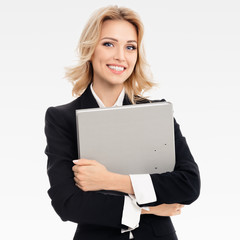 Naklejka premium Young smiling businesswoman with grey folder