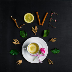 Obraz na płótnie Canvas Tea with lemon on a black background