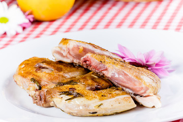 Grilled chicken on white plate