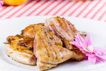 Grilled chicken on white plate