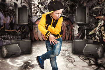 The little boy in the style of Hip-Hop . Children's fashion.Cap and jacket. The Young...