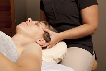 Fototapeta na wymiar Massage therapist massaging client