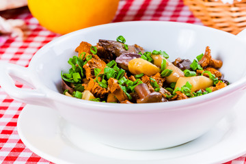 Marinated mushrooms in white bowl