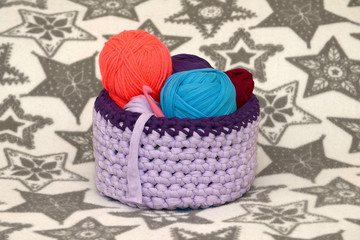 Handmade basket and colorful yarn.