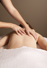 Obraz na płótnie Canvas Massage therapist massaging client