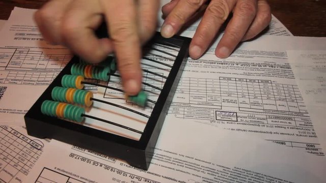 calculate outstanding payments on old wooden abacus