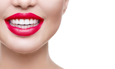 Fototapeta premium Healthy smile, teeth whitening. Beautiful model girl with red lips isolated on white background