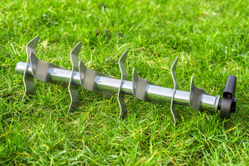 Aerating roller on the grass