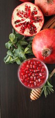 Homemade pomegranate wine, still life in rustic style, vintage wooden background, selective focus