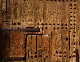 Ancient wooden door in Valencia Torres de Serranos