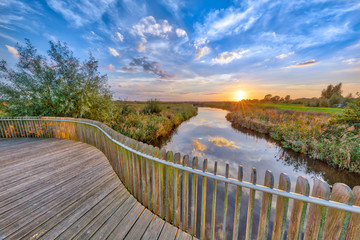 Sunset over Wooden Balustrade  on bridge