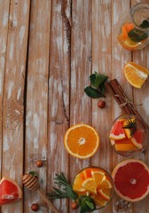Selection of infused water for detox, wood background