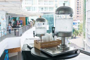 Drinking Water dispenser with Ice and Plastic Cup on the Table for meeting, Seminar or conference...