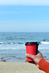 man holding a coffee
