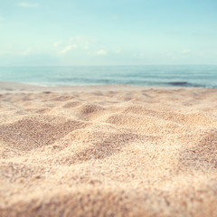Sand beach tropical with blurred sea sky and sunny background, summer day, copy space or for product.