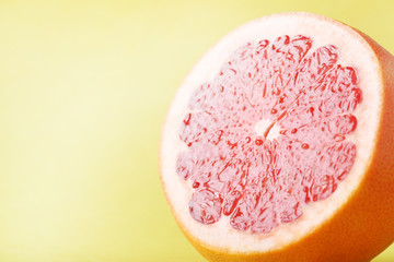 Sweet grapefruit fruit on a yellow background