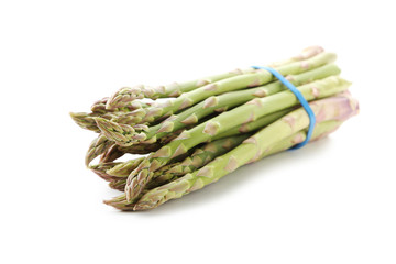 Heap of green asparagus isolated on a white background