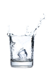 Glass of water with ice cube isolated on a white