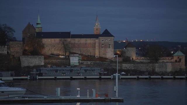 Akershus Fortress Over Harbor in Oslo at Night