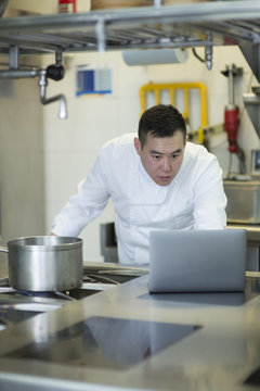 Chinese cook with portable computer