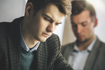 Handsome guys at workplace