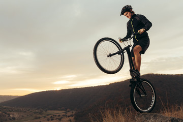 Fototapeta na wymiar An extreme sportsman on bike