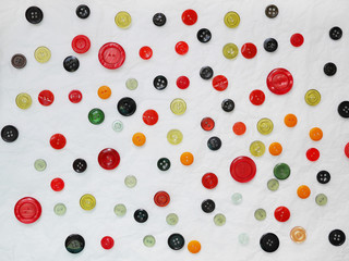 Background of multi-colored buttons. Abstract background. Pattern of buttons on a white background.