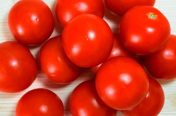 Red tomatoes background. Group of tomatoes. Top view.