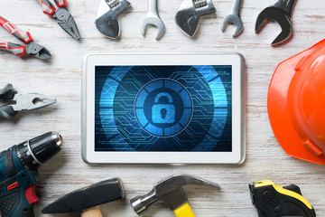 Web security and technology concept with tablet pc on wooden table © adam121