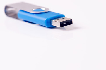 Detail of Usb flash drive on a white background. Flash drive is located in the corner of picture. Concept of technology. Isolated