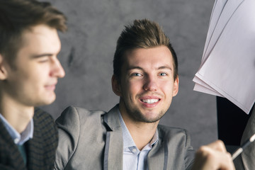 Handsome businessmen at workplace