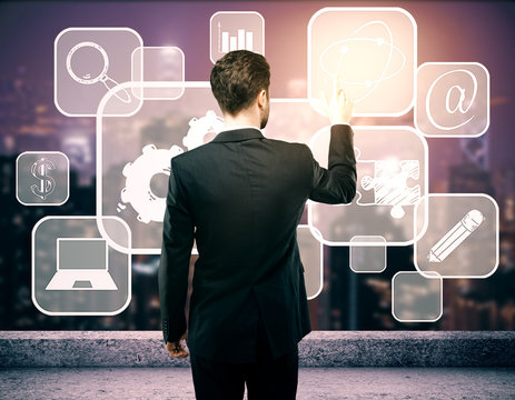 Businessman managing business icons