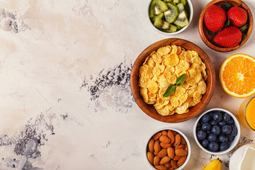 Healthy breakfast - bowl of corn flakes, berries and fruit © tbralnina