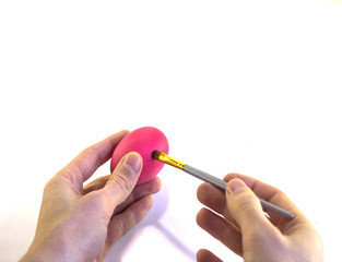 Hand painting Easter eggs on a white background